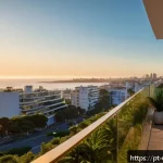 우루과이에서 부동산 매매 - A modern upscale apartment building in Montevideo&rsquo;s Pocitos neighborhood at sunset, featuring sleek ...
